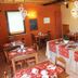 La Perla del Sile Country House in Silea dining room with set tables and heart decorations