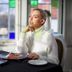 Arensburg Boutique Hotel & Spa in Kuressaare: woman dining beside stained glass windows