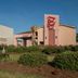 Red Roof Inn Virginia Beach - Norfolk Airport exterior with landscaped grounds and clear blue sky