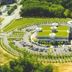 Aerial view of Motel 6 Greenville - Simpsonville with circular parking and surrounding trees in Simpsonville
