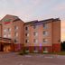Fairfield Inn & Suites by Marriott Seymour exterior at sunset with covered entrance and parking lot