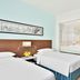Fairfield by Marriott Bengaluru Outer Ring Road guest room with two twin beds and bathroom view