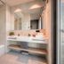 Downtown Apartments Mitte Berlin bathroom with bathtub, double sink vanity and large mirror