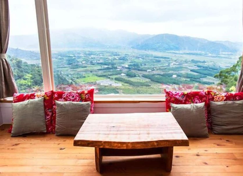 Shangrila Leisure Farm in Dongshan Township with a valley view from a window seat and wooden table