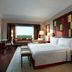 JW Marriott Hotel Bengaluru room with king bed, window seating area, and city view