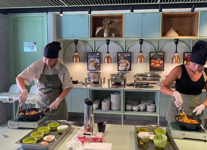 Samsen Street Hotel in Bangkok buffet station with two chefs cooking at a counter