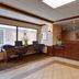 Quality Inn & Suites in Williamsport lobby with front desk, wood paneling, and tiled floor