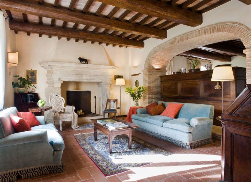 Torre Palombara - Dimora Storica lounge with fireplace, exposed beams, and sofas in Narni