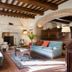 Torre Palombara - Dimora Storica lounge with fireplace, exposed beams, and sofas in Narni