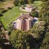 Aerial view of Agriturismo La Meria in Semproniano, surrounded by trees and countryside