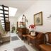 Soggiorno Burchi in Florence hallway with staircase, skylight, vintage chairs and wooden desk