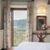 Relais Poggio Borgoni room with balcony view over hills in San Casciano Val Di Pesa
