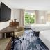 Fairfield Inn & Suites by Marriott Harrisburg Hershey guest room with two beds, desk, and window view
