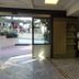 Hotel Zeus Pompei lobby with reception desk, entry doors, and view to the outside