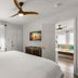 Hotel Cabana Clearwater Beach guest room with king bed, ceiling fan, window and adjoining sitting area.