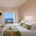 Oasis Scaleta Hotel room with sea-view balcony, bed, and desk in Skaleta