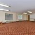 Americas Best Value Inn & Suites Morrow Atlanta meeting room with carpet, tables, windows and wall-mounted TV
