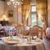 Château de Noizay in Noizay elegant dining room with set tables, chandeliers and tall windows