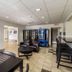 Studio 6 McAllen TX lobby with seating area and vending machines in McAllen