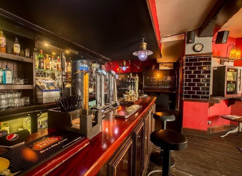 Golden Eagle in Chester bar interior with polished counter, beer taps and high stools