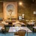 Arass Hotel & Business Flats Antwerp breakfast room with tables, chairs, buffet counter and wall mural