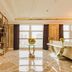 Pearl River Garden Hotel Changsha lobby with polished marble floors, seating, and city-view windows