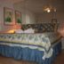 The Breakers Oceanfront 1 Bedroom Villas bedroom with king bed and mirrored wall in Hilton Head Island