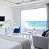 Knossos Beach Bungalows Suites Resort & Spa in Kokkini Hani with sea view from bright bedroom