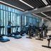Hotel Arima & Spa gym in San Sebastian with treadmills and exercise bikes by floor-to-ceiling windows