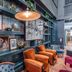 Hotel Indigo Nashville - The Countrypolitan By IHG lounge with teal shelving and orange chairs