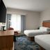 Hampton Inn by Hilton Hopewell Fort Lee guest room with two beds, desk, TV and window seating