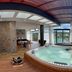 Vivanti Resort in Guatapé indoor hot tub with lake and mountain views through floor-to-ceiling windows