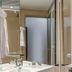 StayEasy Pretoria bathroom with sink, mirror, towel rack and glass shower enclosure