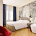 Fh55 Grand Hotel Mediterraneo room in Florence with two beds and a black-and-white mural wall