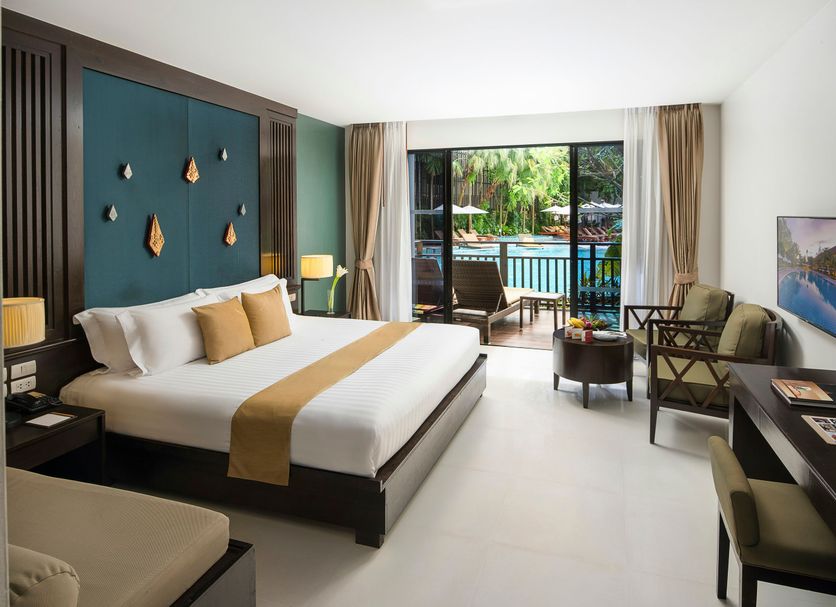 Centara Anda Dhevi Resort & Spa Krabi room with balcony view of pool and tropical greenery in Ao Nang