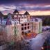 1886 Crescent Hotel and Spa in Eureka Springs at sunset, with a castle-like stone exterior and towered roofline