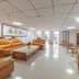 OYO Hexi Hotel in Zhangye lounge with leather sofas, coffee table and wicker chairs
