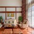 Beijing Jinyu Badaling Resort in Beijing lounge with ornate sofa set, coffee table and floor-to-ceiling sheer curtains