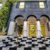 Balboa Park Hotel San Diego entrance with arched portico and black-and-white checkerboard steps