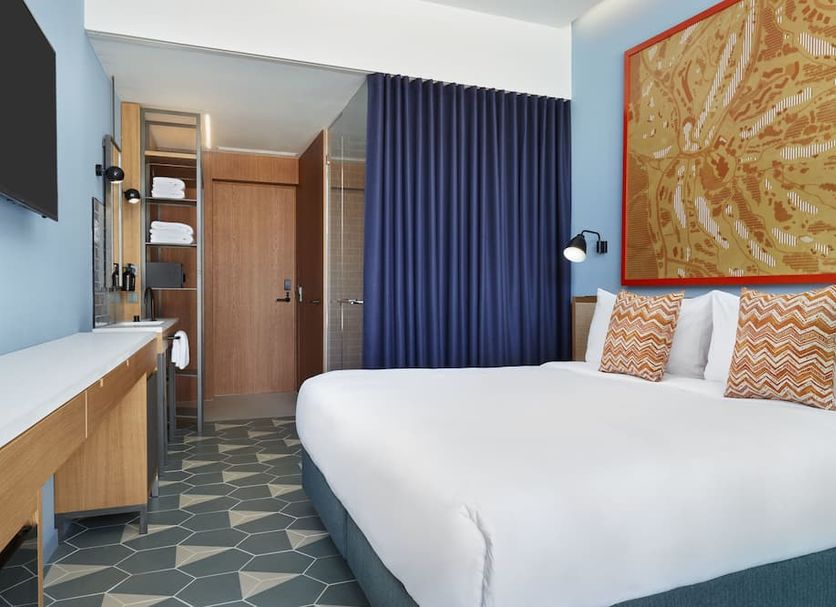 Lavida Hotel At Camiral Golf & Wellness room in Caldes de Malavella with king bed, desk and patterned floor