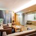 Original Sokos Hotel Vaakuna Joensuu lounge with seating, wood accents and a glass partition in Joensuu