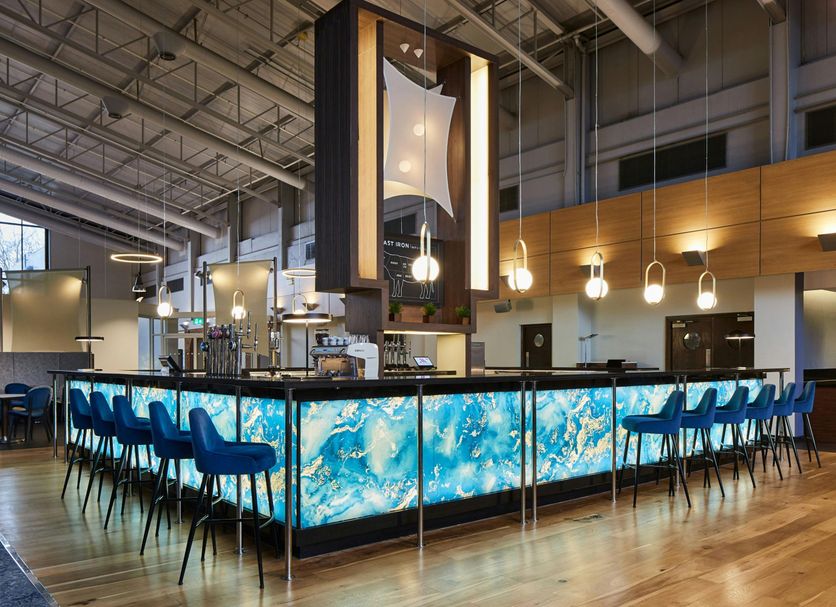 Portsmouth Marriott Hotel bar with illuminated blue marble counter and blue stools in Portsmouth