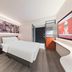 ibis Beijing Dacheng Road guest room with double bed, wall art, desk and TV in Beijing
