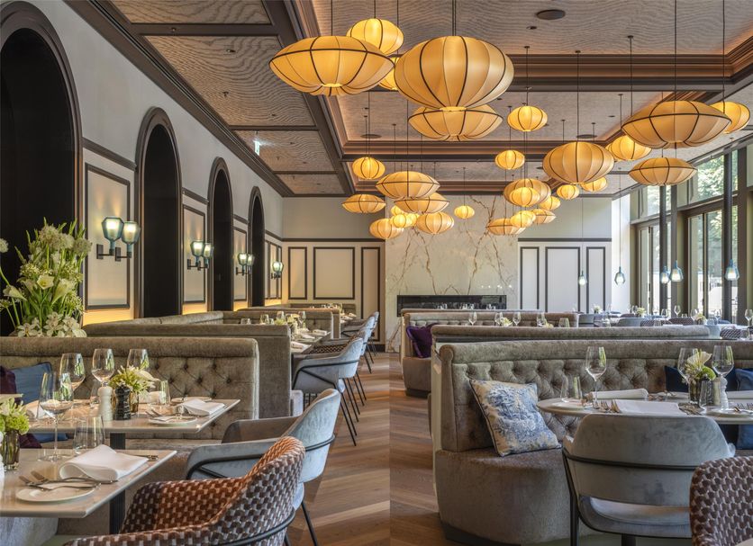 Europäischer Hof in Baden-Baden restaurant with plush seating and warm hanging lanterns