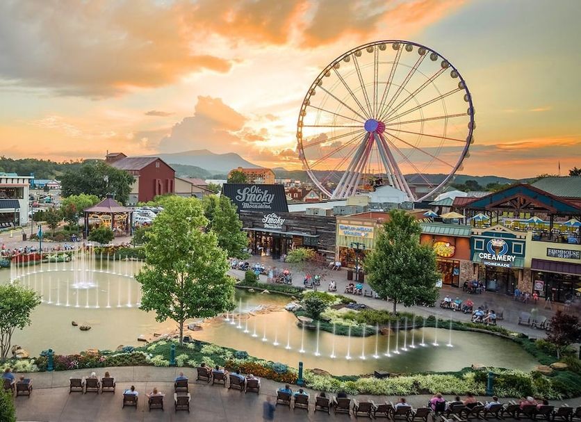 Compass by Margaritaville Hotel Pigeon Forge with ferris wheel and fountain view at sunset