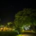 Puerto Valle Hotel De Esteros in Puerto Valle at night, lit lodge surrounded by lush tropical trees