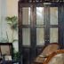 Prince of Galle (inside the Fort) in Galle: dark wood doors, cane chairs, and potted palms in a courtyard