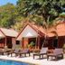 Blue Diamond Resort in Ko Tao with poolside villas and lounge chairs amid tropical greenery