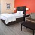 La Bonita Inn & Suites - McCamey guest room with bed, sofa, and coffee table