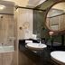 Meliá Paris Vendôme bathroom with bathtub, double sinks, large mirror and marble finishes in Paris